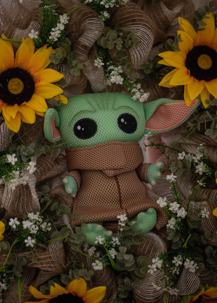 A Close-Up Shot Of A Baby Yoda Plush Toy