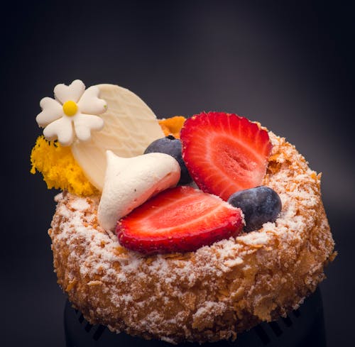 Selective Focus Photo of a Delicious Dessert with Fruits on Top