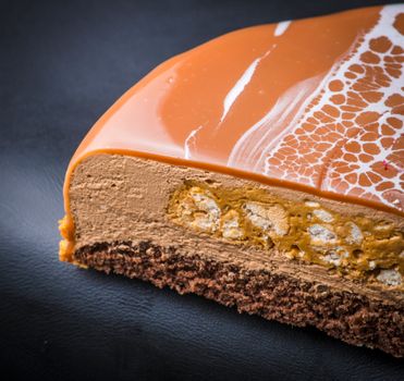 Piece of Delicious Nougat Cake in Brown Icing