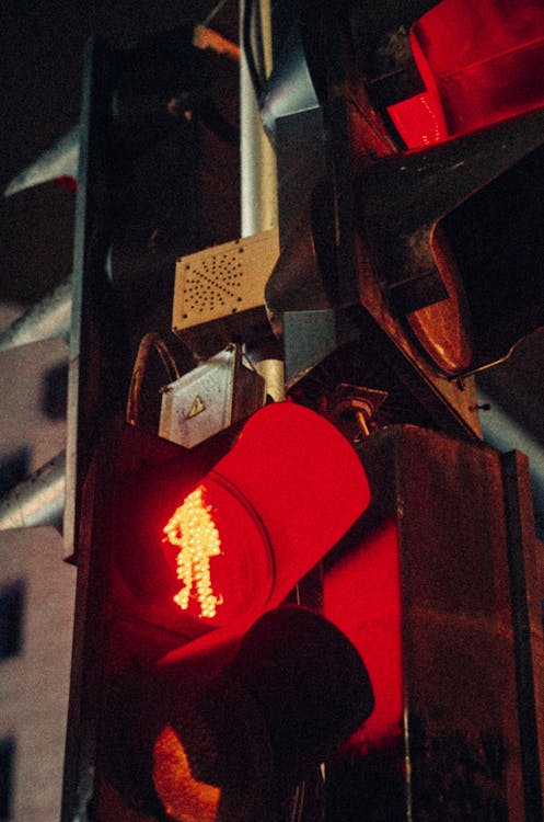 Close-up of a Red Traffic Light on a Street Crossing 