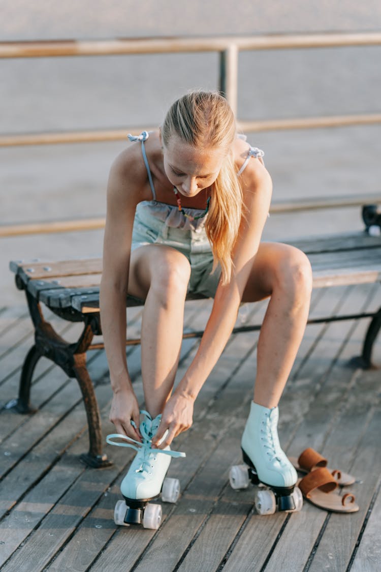 A Woman Putting On Skates