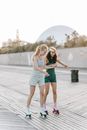 Women on Skates in the Wooden Skate Park