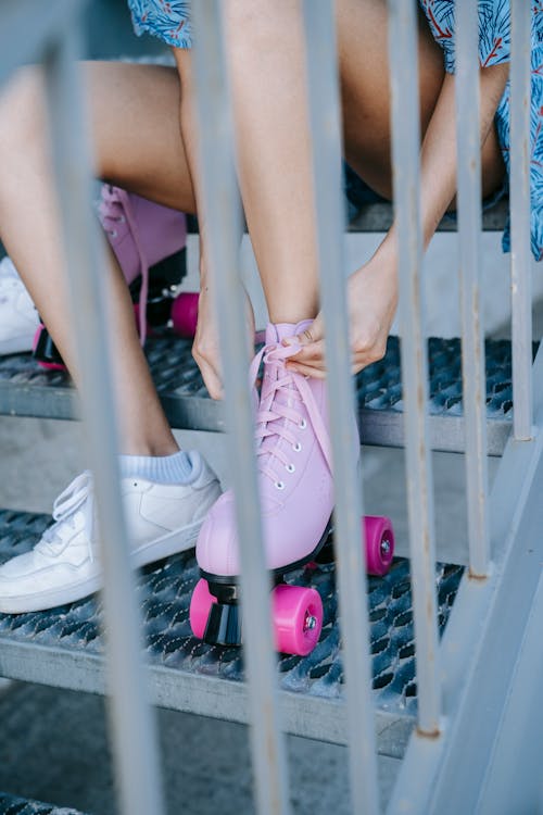 Free 
A Woman Wearing Roller Skates while Sitting Stock Photo