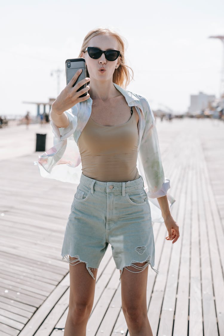 Woman Making Selfie On Smartphone On Beach