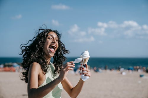A Happy Woman Holding Ice Cream