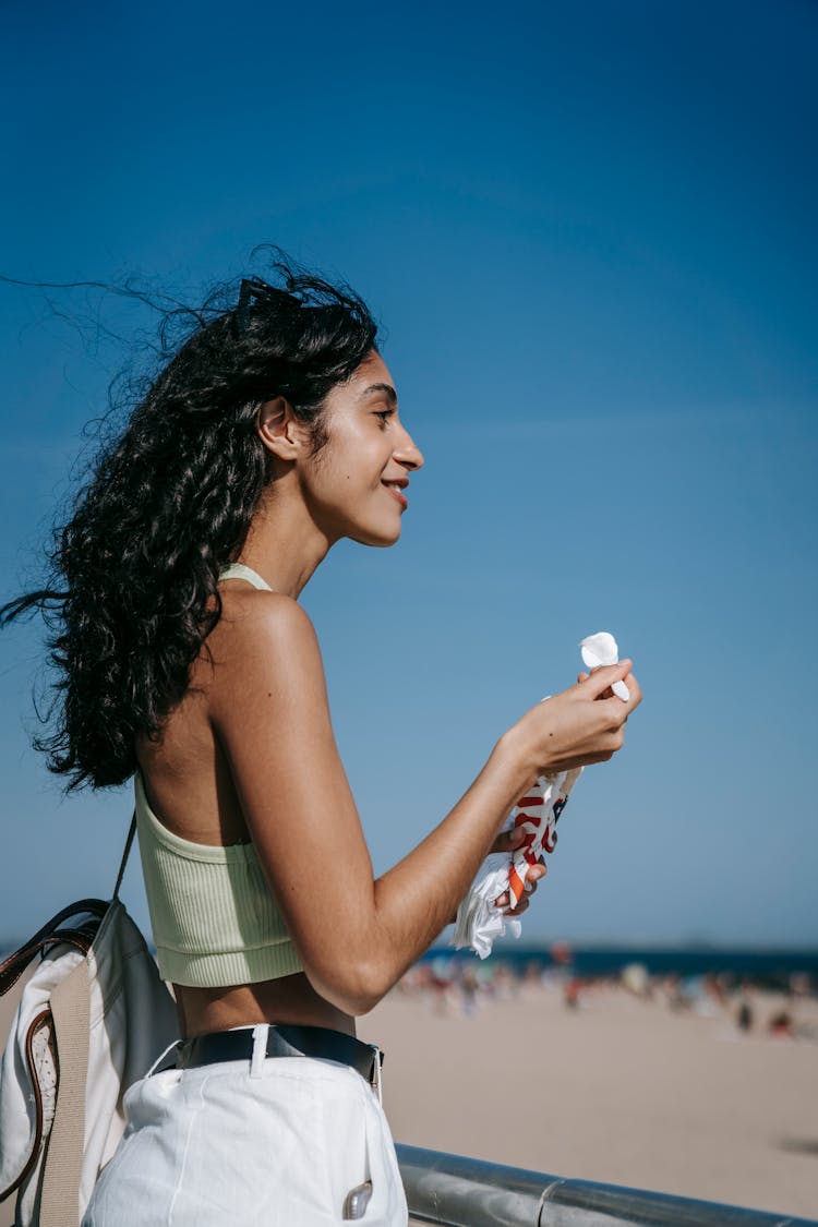 Woman Using A Spoon Eating An Ice Cream