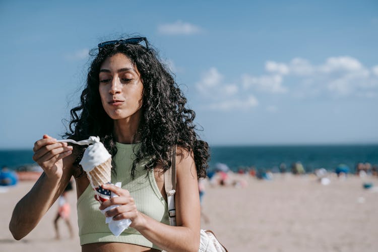 Woman Eating Vanilla Ice Cream