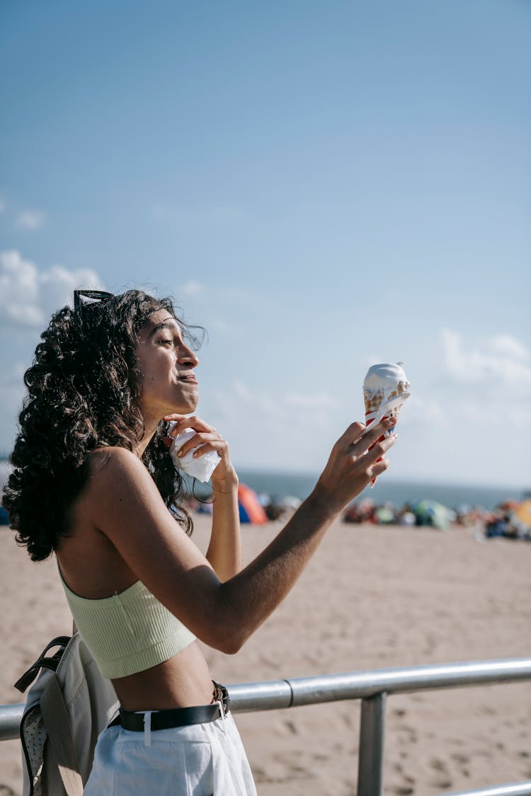 Woman Holding Her Melting Ice Cream