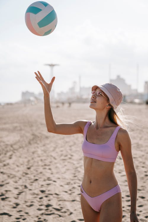 Free Woman Tossing a Volleyball Stock Photo