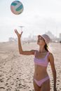 Woman Tossing a Volleyball