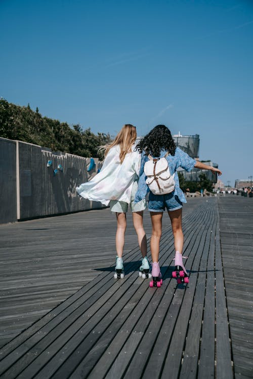 Young Women Roller Skating 