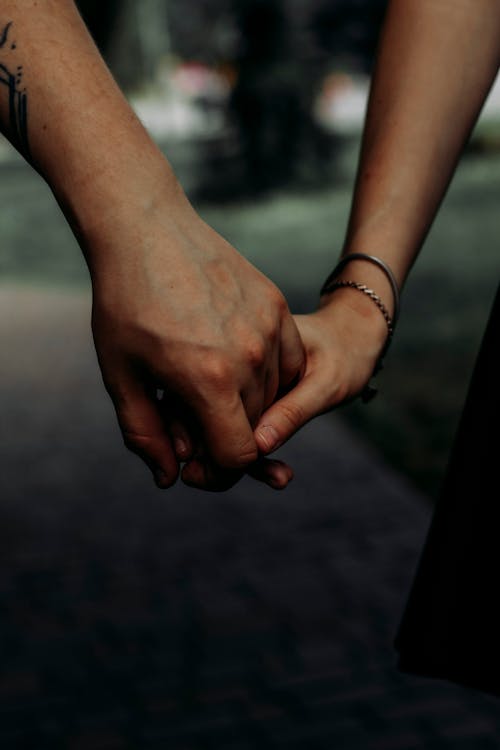 Close-Up Shot of Holding Hands