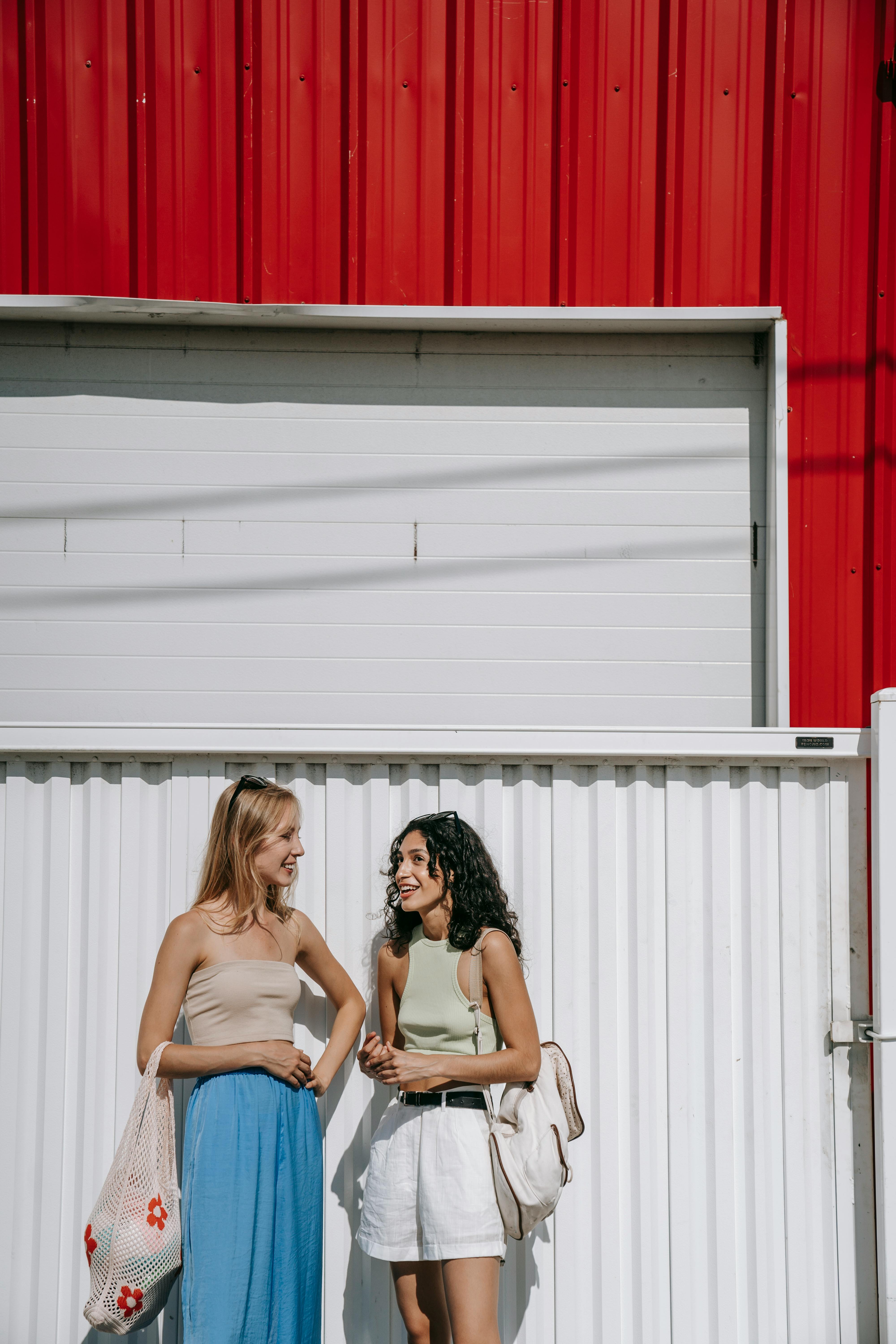 women talking on street