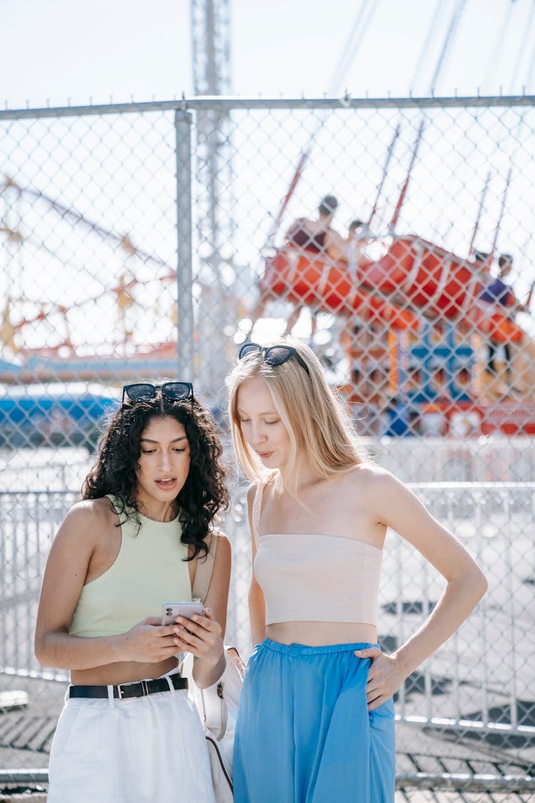 Two Girls Looking At The Phone 