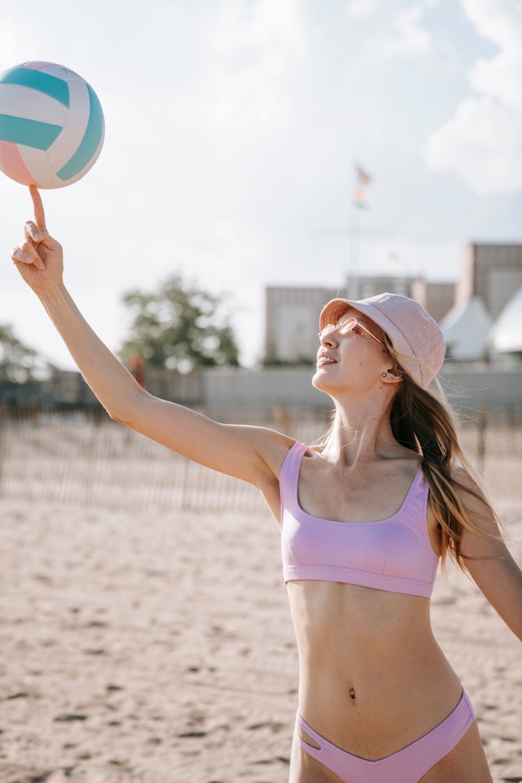 A Woman Playing With A Volleyball