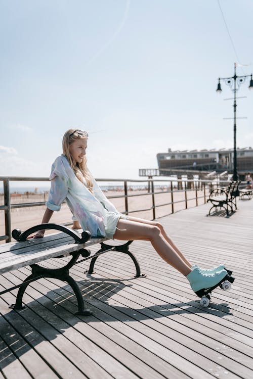 Woman with Roller Skates Resting on Promenade