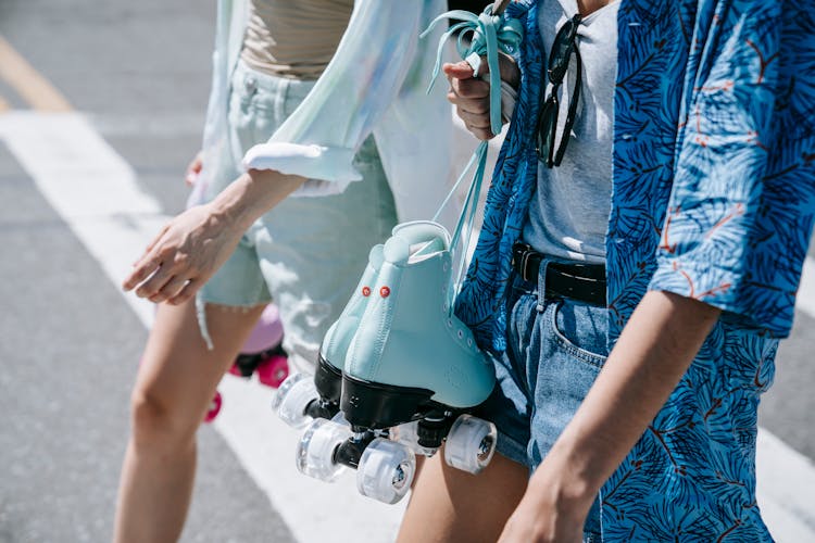 Women Carrying Roller Skates