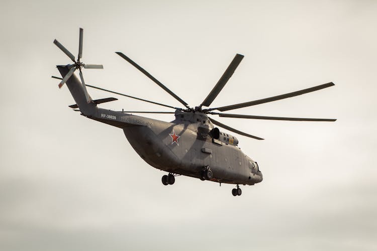 A Military Helicopter Flying In The Sky