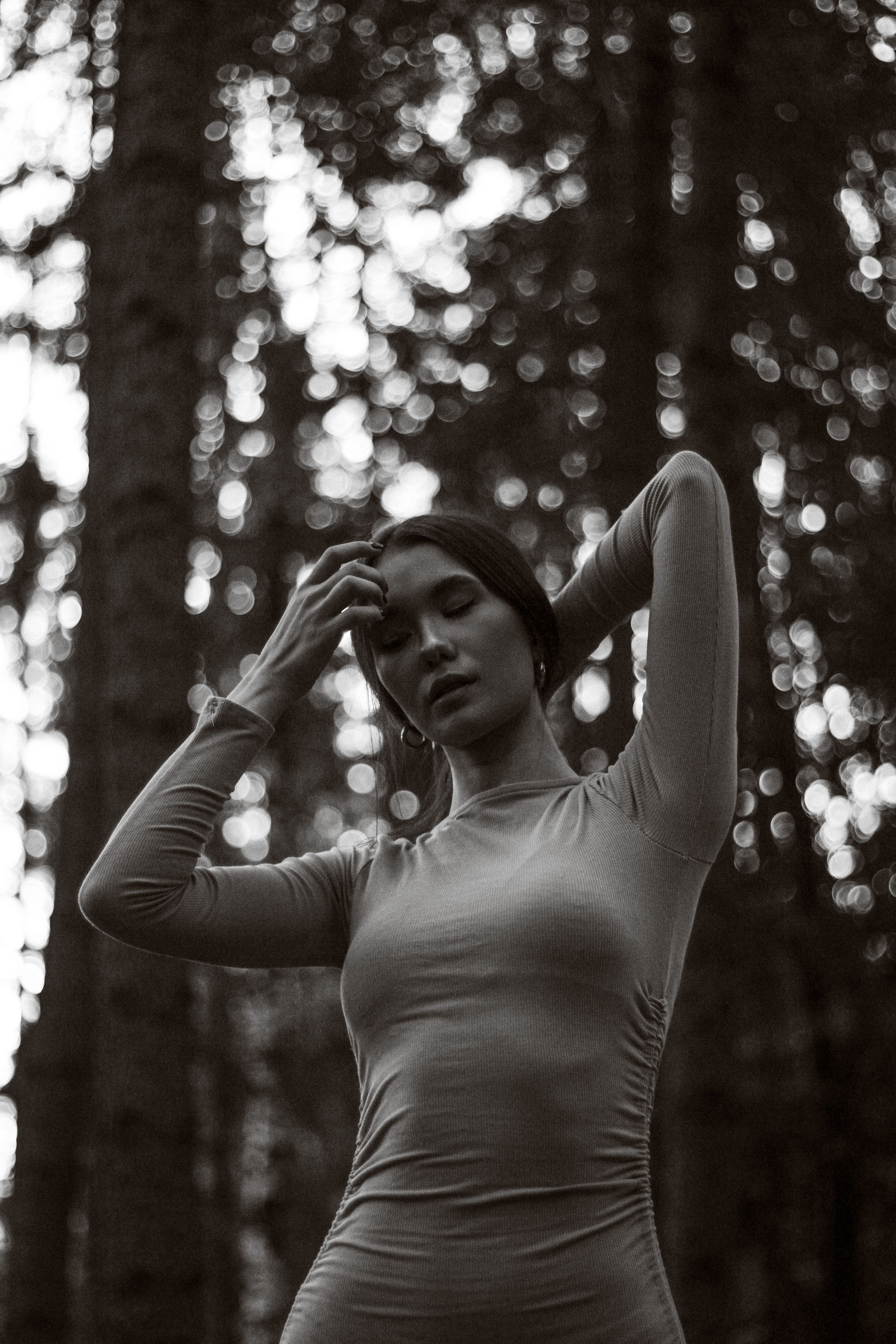 Grayscale Photo of a Pretty Woman in a Dress Posing · Free Stock Photo