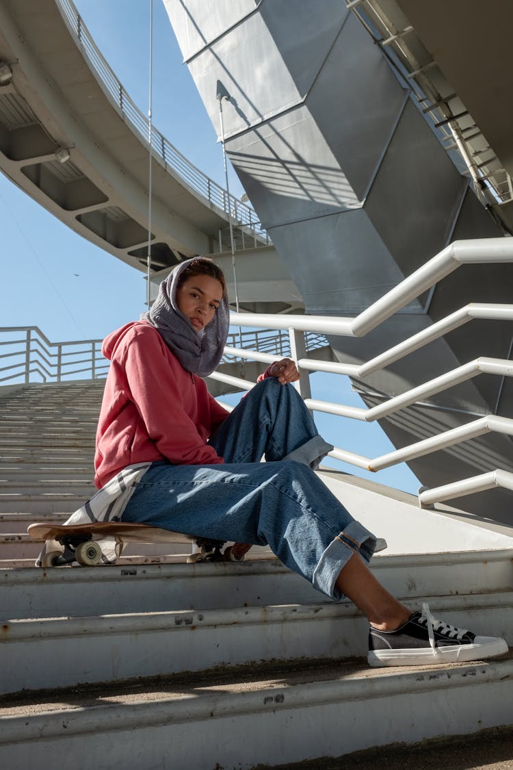 A Woman Posing On The Stairs 