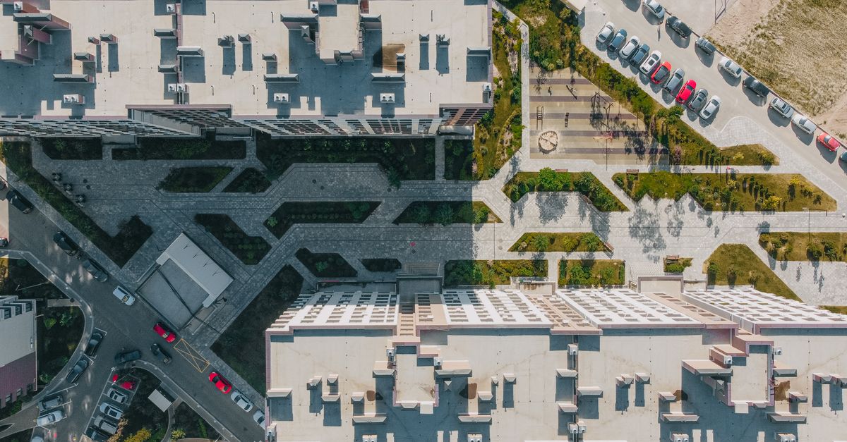 Aerial shot showcasing modern urban architecture and green spaces in Kyiv, Ukraine.
