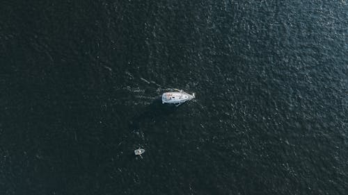 Aerial View of a Yacht Sailing on the Sea