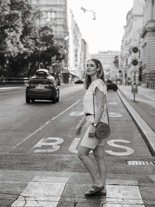 Free A Woman Crossing on the Pedestrian Lane Stock Photo