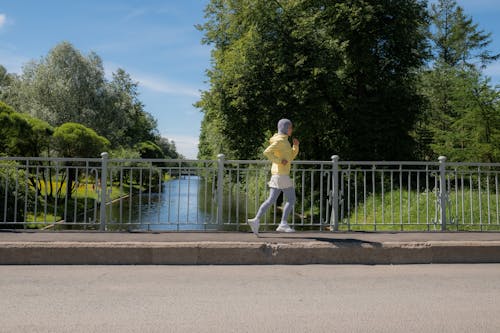 Woman Jogging on a Sidewalk