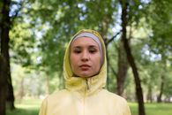 A Woman Wearing a Hijab and a Windbreaker