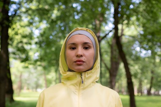 
A Woman Wearing a Hijab and a Windbreaker