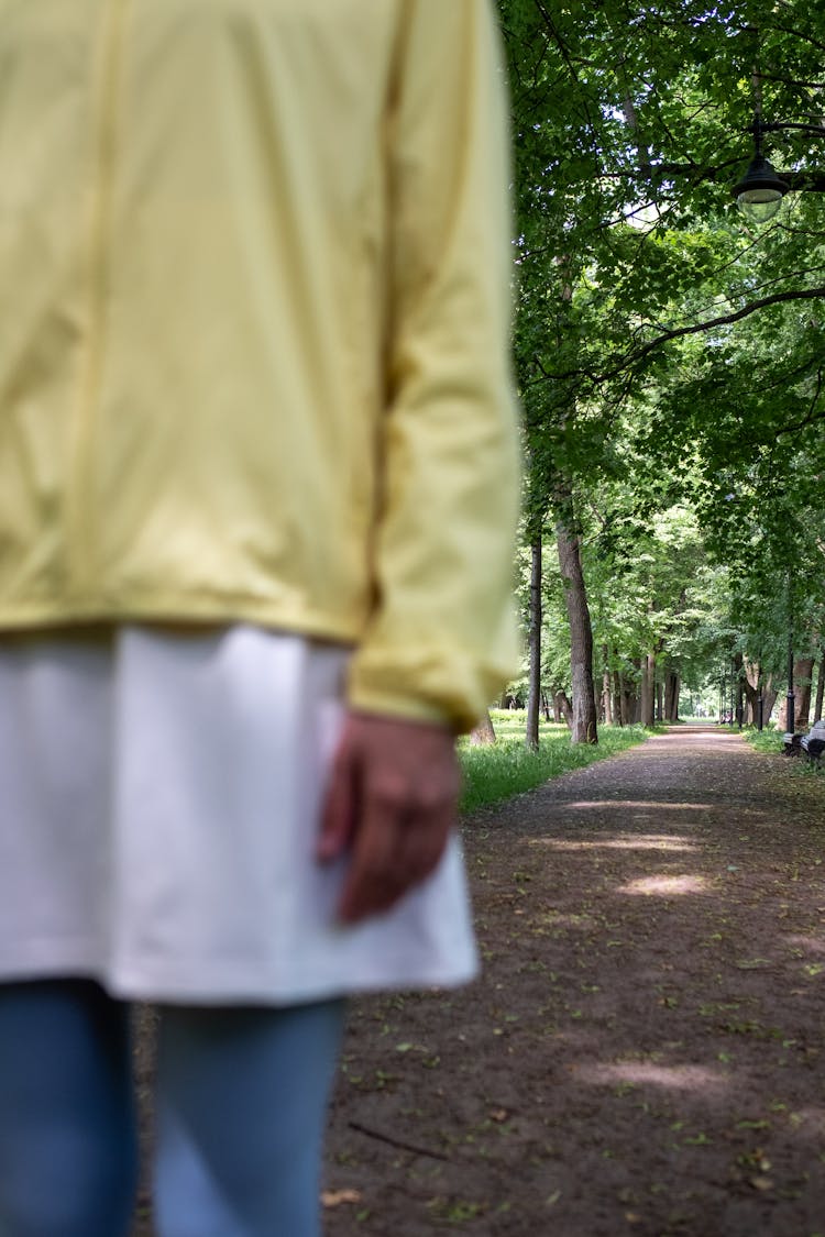 Person Standing On A Pathway