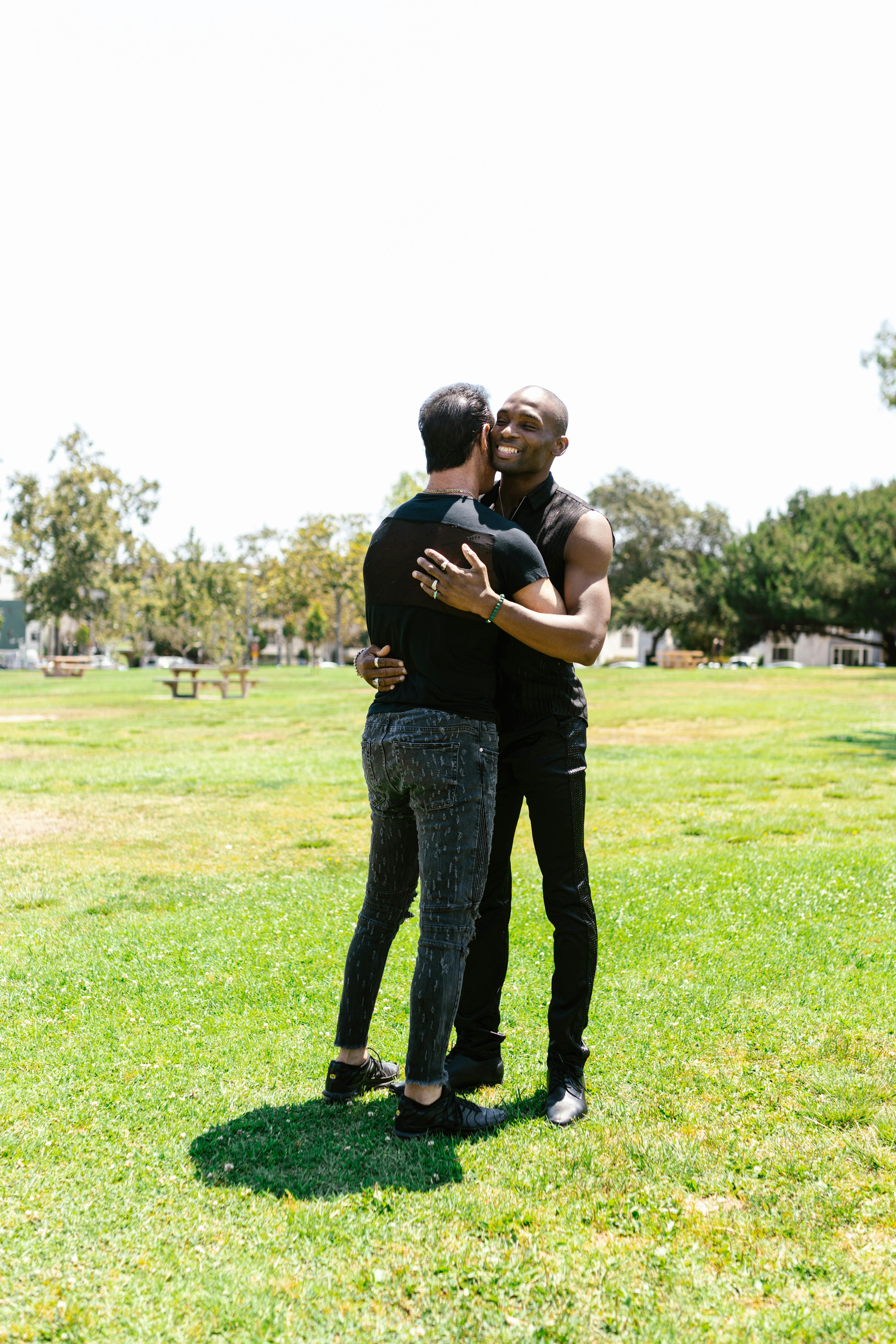 couple hugging each other at the park