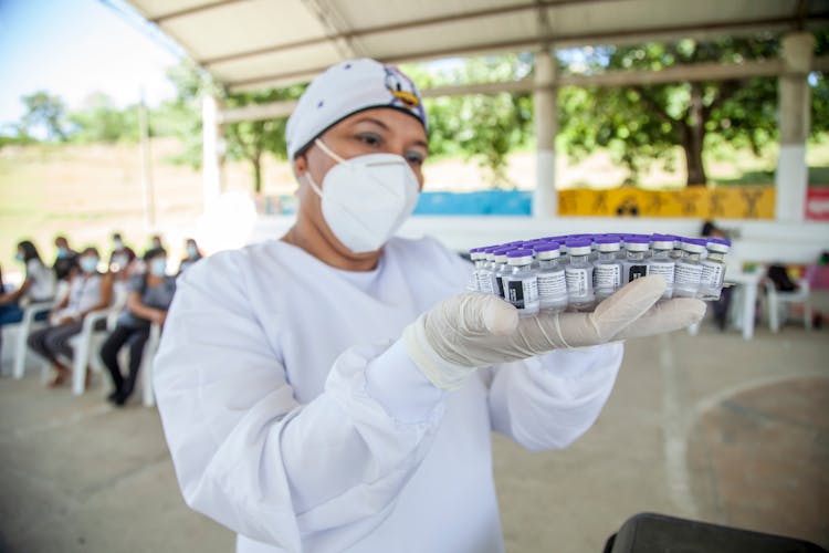 A Nurse Holding Vaccines