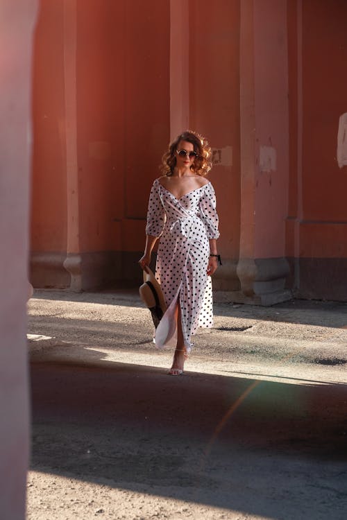 A Woman in Polka Dot Dress Standing