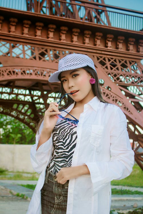 A Pretty Woman in White Long Sleeves Posing