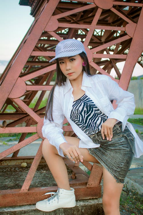 A Pretty Woman in White Long Sleeves Posing