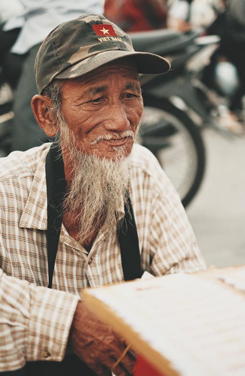 Close-Up Photo of an Elderly Man with a Gray Beard