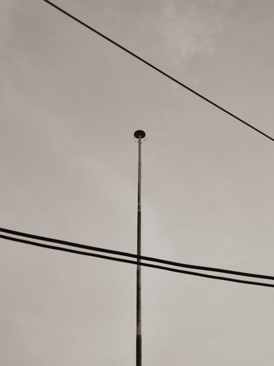 An Electric Cable Wires Under Gray Sky