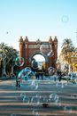 People Walking on the Street With Bubbles