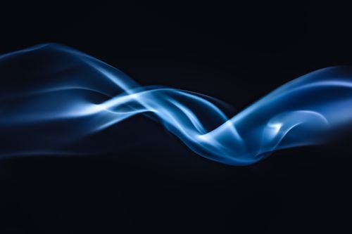 Free Dynamic swirls of blue smoke on a dark backdrop, perfect for artistic projects. Stock Photo
