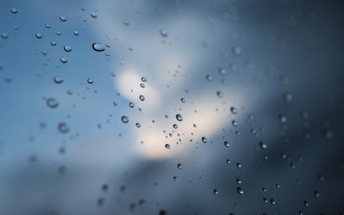 Close-Up Shot of Water Droplets on a Glass Window