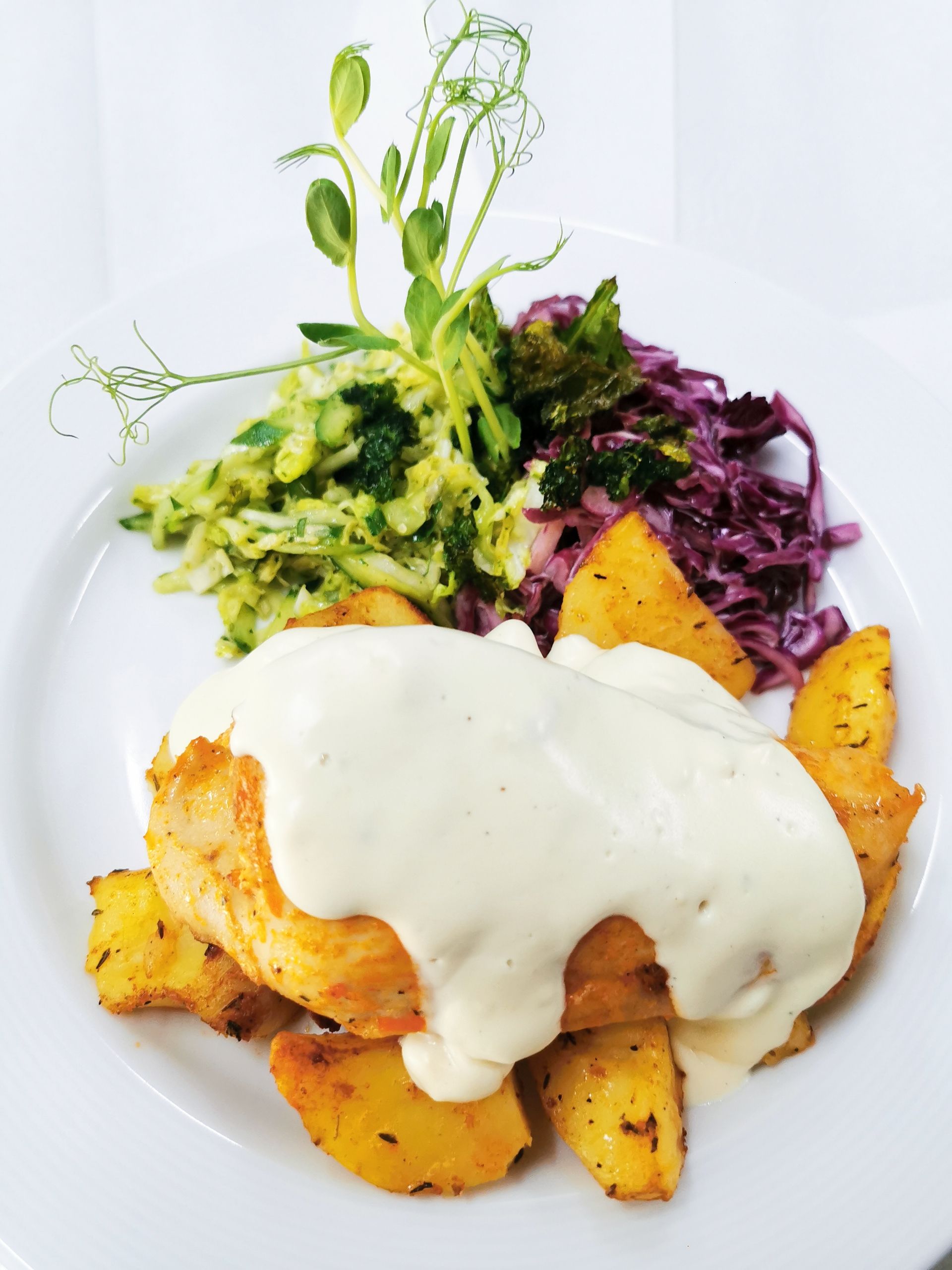 Delicious chicken breast with creamy sauce and vegetables, perfect for gourmet dining.