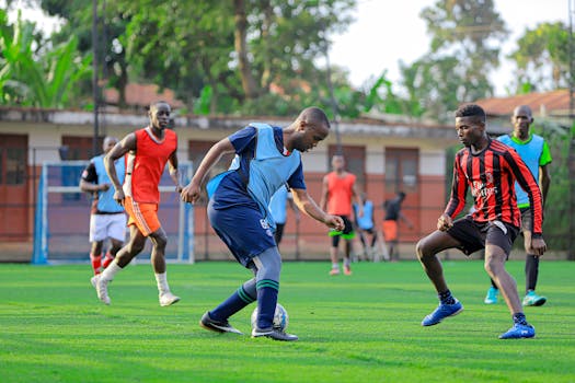 A group of young athletes training on a soccer field, displaying teamwork and skill.