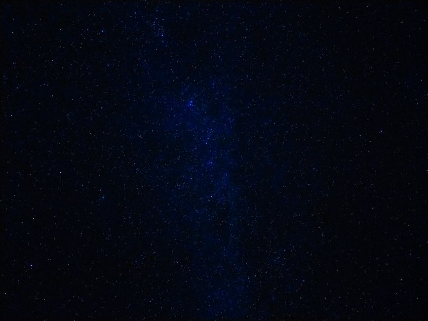 A mesmerizing view of a clear starry night sky showcasing countless stars twinkling in the darkness.