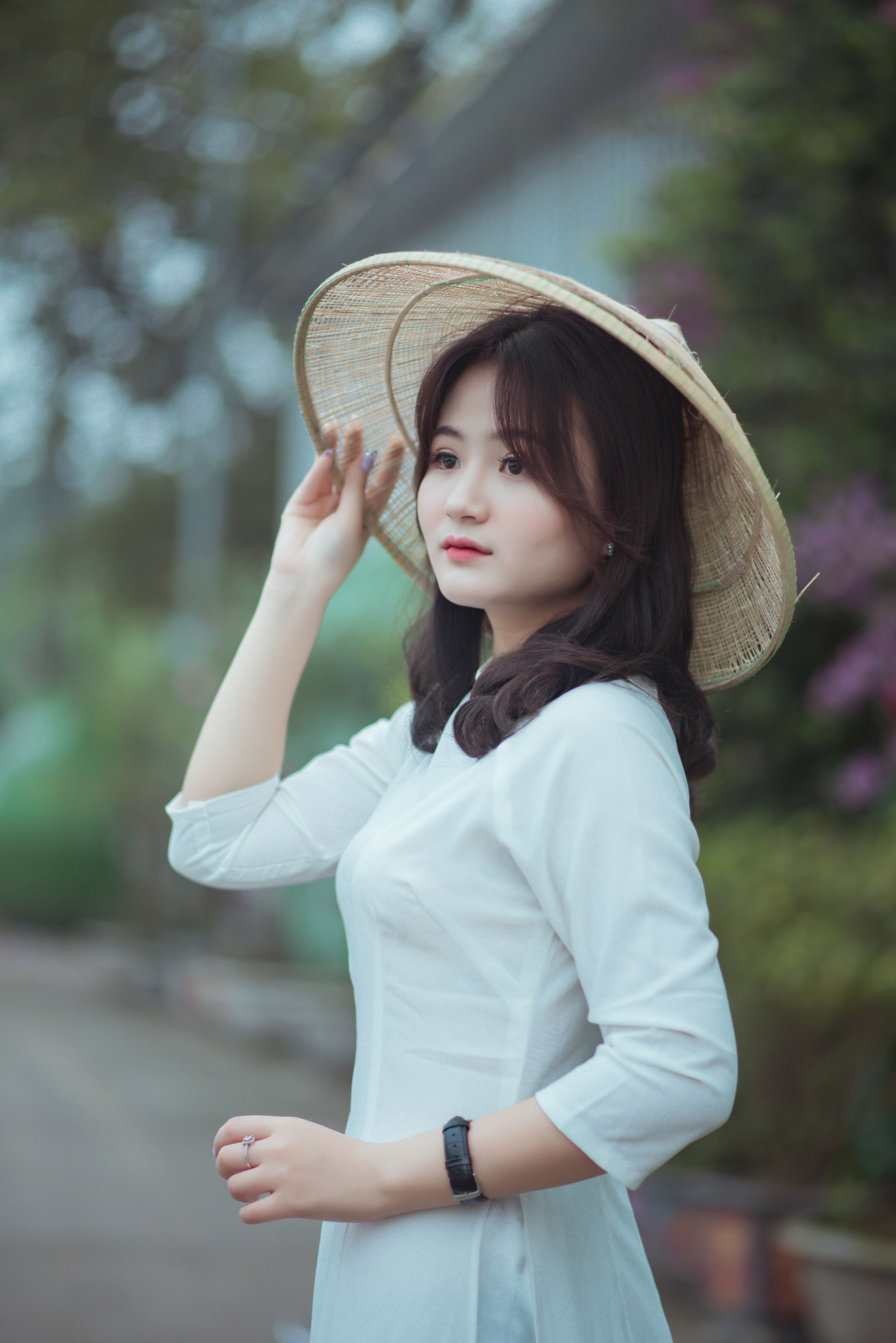 A Woman Wearing a White Dress and Hat · Free Stock Photo