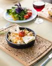 Black Ceramic Bowl With Red Wine