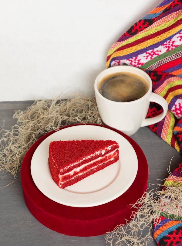 White Ceramic Mug on Red Round Plate