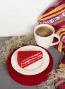 White Ceramic Mug on Red Round Plate