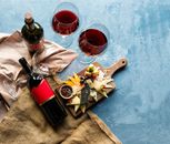 Wine Bottle With Red Wine on Table
