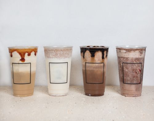 Free A variety of iced coffee beverages in clear plastic cups, showcasing different flavors and layers. Stock Photo